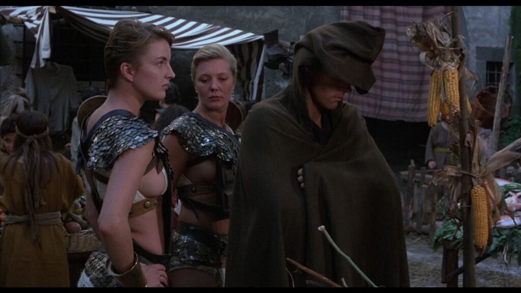 MV5BNzJjZTAyNzAtZGY4NS00NGE2LThjYTUtNWJiMjJlNzI1NGI3XkEyXkFqcGc@._V1_-1024x576 Cine de Videoclub | SHE (1984) | Amazónicas desnudas, senos ofrecidos al delirio visual, erotismo de inspiración sexploitation, entre los metales relucientes de la espada y las sombras